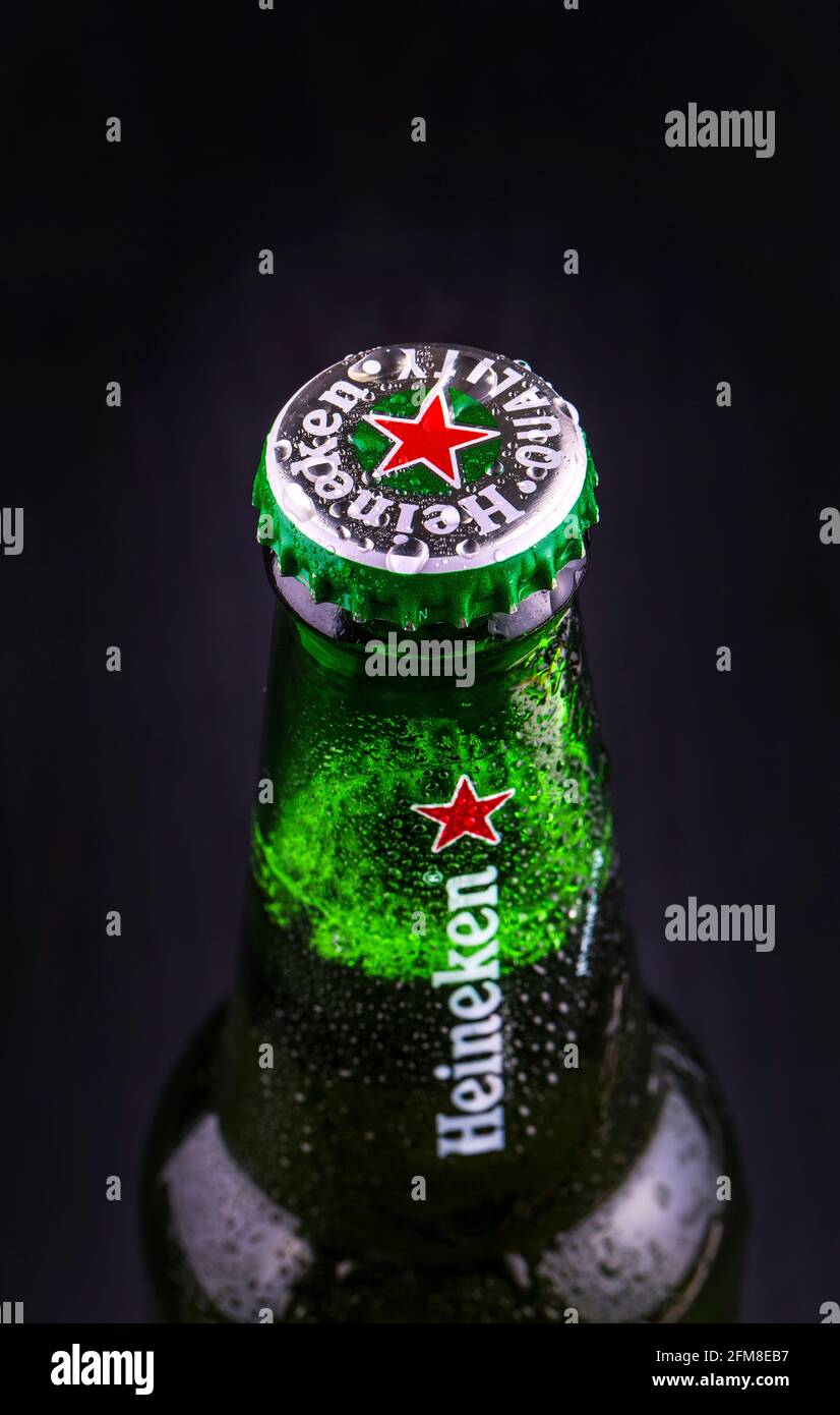 KAMCHATKA- OCTOBER -07, 2016 : Bottle of Heineken beer over black wooden background. Special edition for UEFA European Championship. Heineken Lager Be Stock Photo