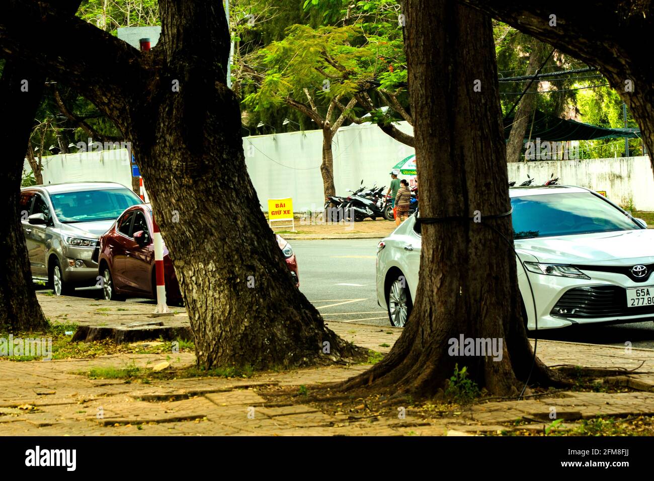onside of street with cars and many people Stock Photo