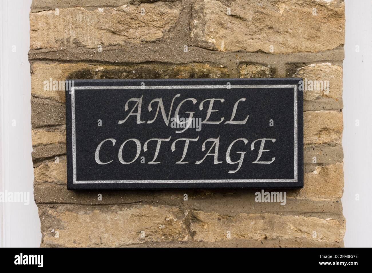 Angel cottage plaque, Tetbury, Gloucestershire, UK Stock Photo