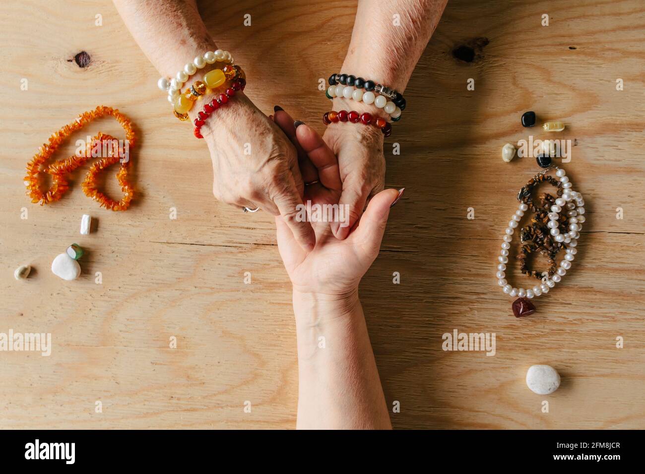 Grandma magic, fortune telling, palmistry. Chiromancy, women hands, destiny reading Stock Photo