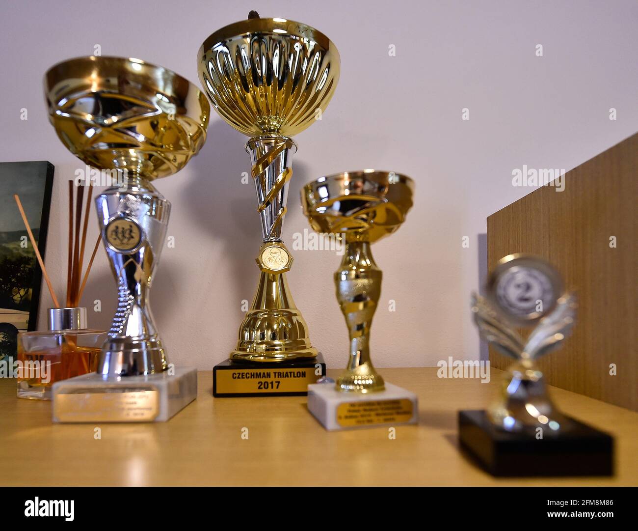 Novy Teleckov, Czech Republic. 07th May, 2021. Trophies of blind cyclist Ondrej Zmeskal are seen on May 7, 2021, in Novy Teleckov, Trebic region, Czech Republic. This year, as the first blind athlete, Zmeskal wants to complete the entire route of the Tour de France on a tandem bicycle. He will combine his performance with the support of blind children through the Svetluska project. Credit: Lubos Pavlicek/CTK Photo/Alamy Live News Stock Photo