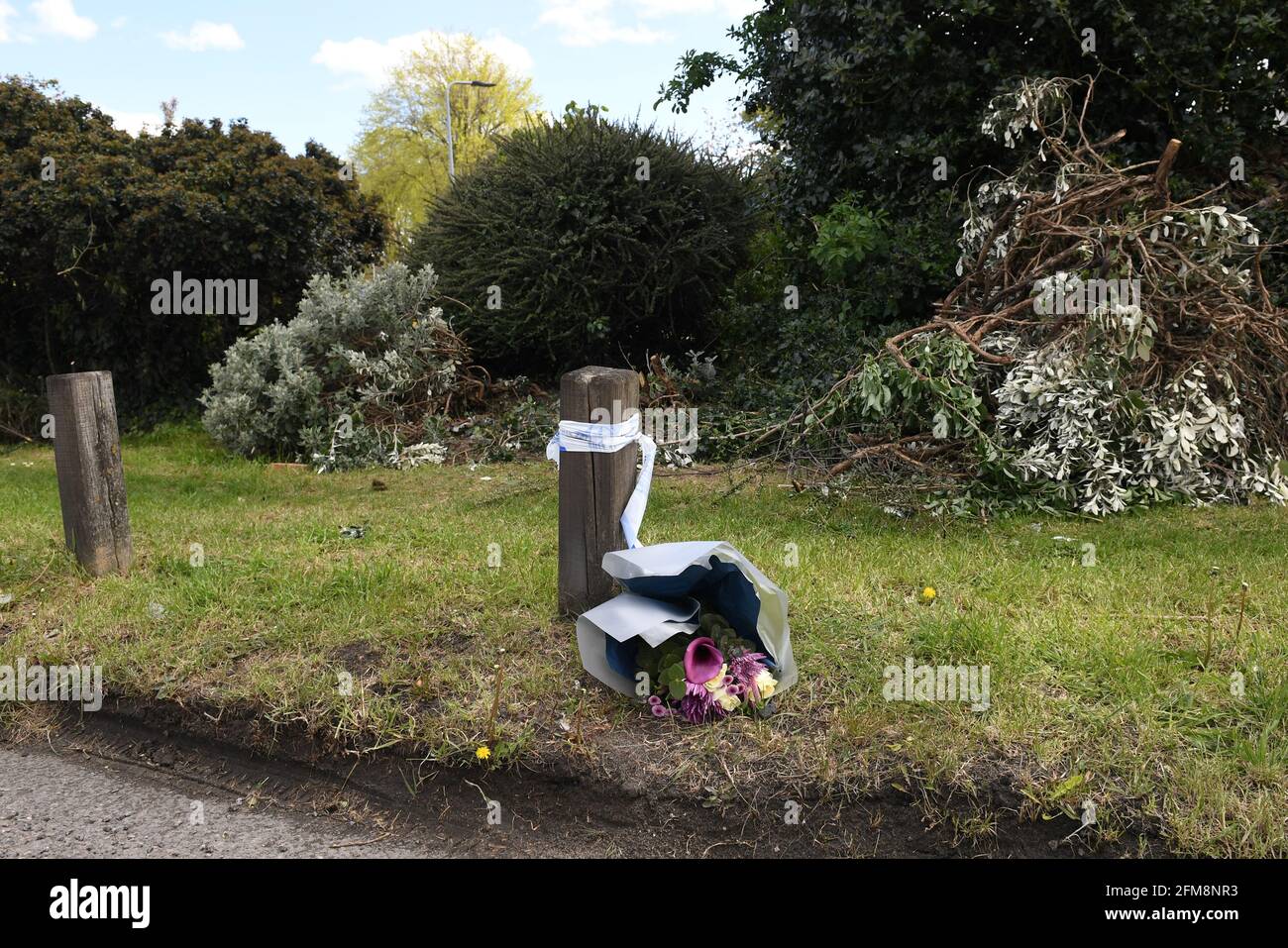 Flowers left at Little Heath, Romford, east London, where Maria Jane Rawlings, 45, was found dead by a man walking his dog at around 2pm on Tuesday. The Metropolitan Police said a post-mortem examination gave the mother-of-two's preliminary cause of death as neck compression and possible blunt force head trauma. Picture date: Friday May 7, 2021. Stock Photo