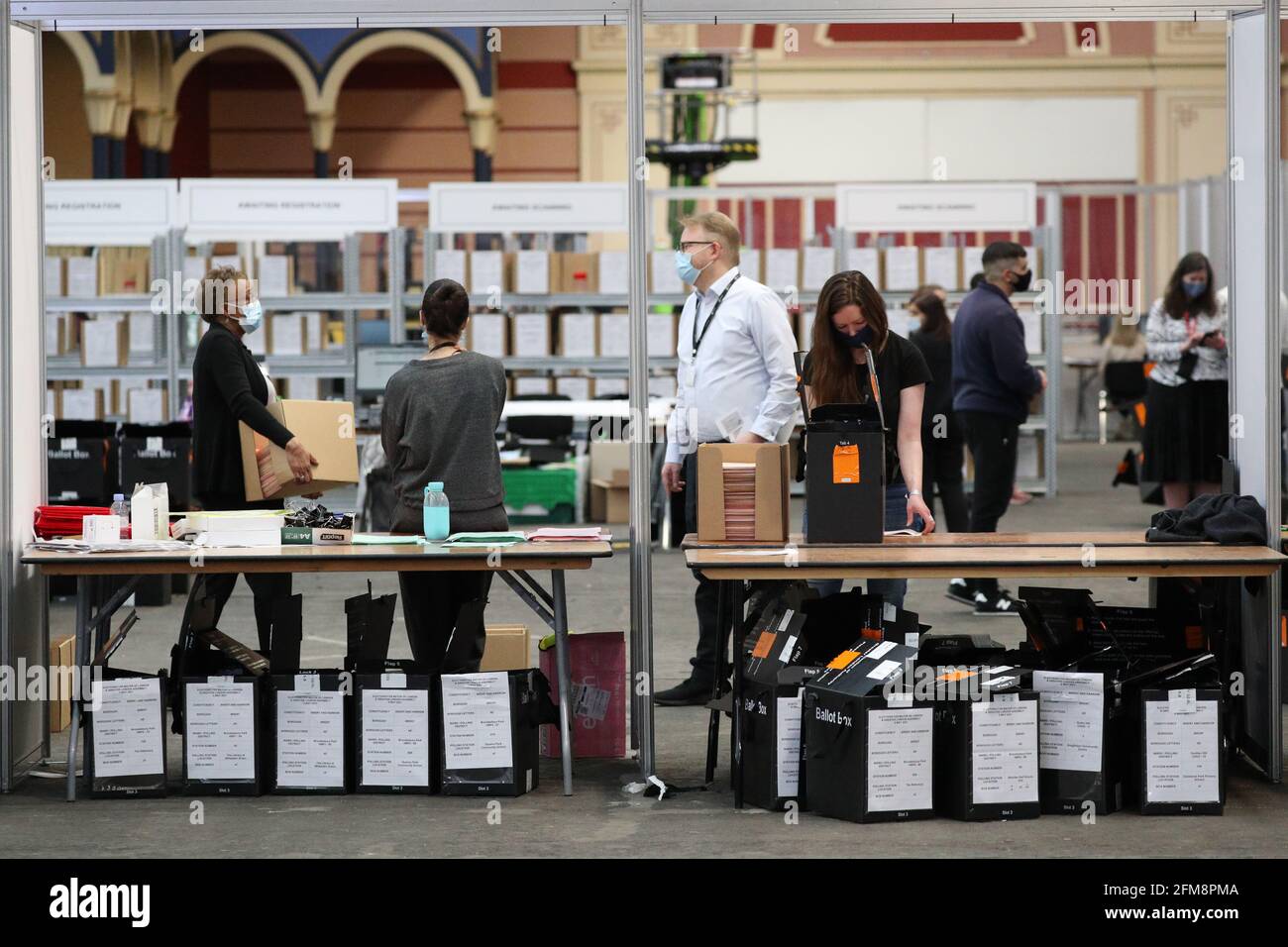 Ballot boxes are emptied during the counting for local elections at