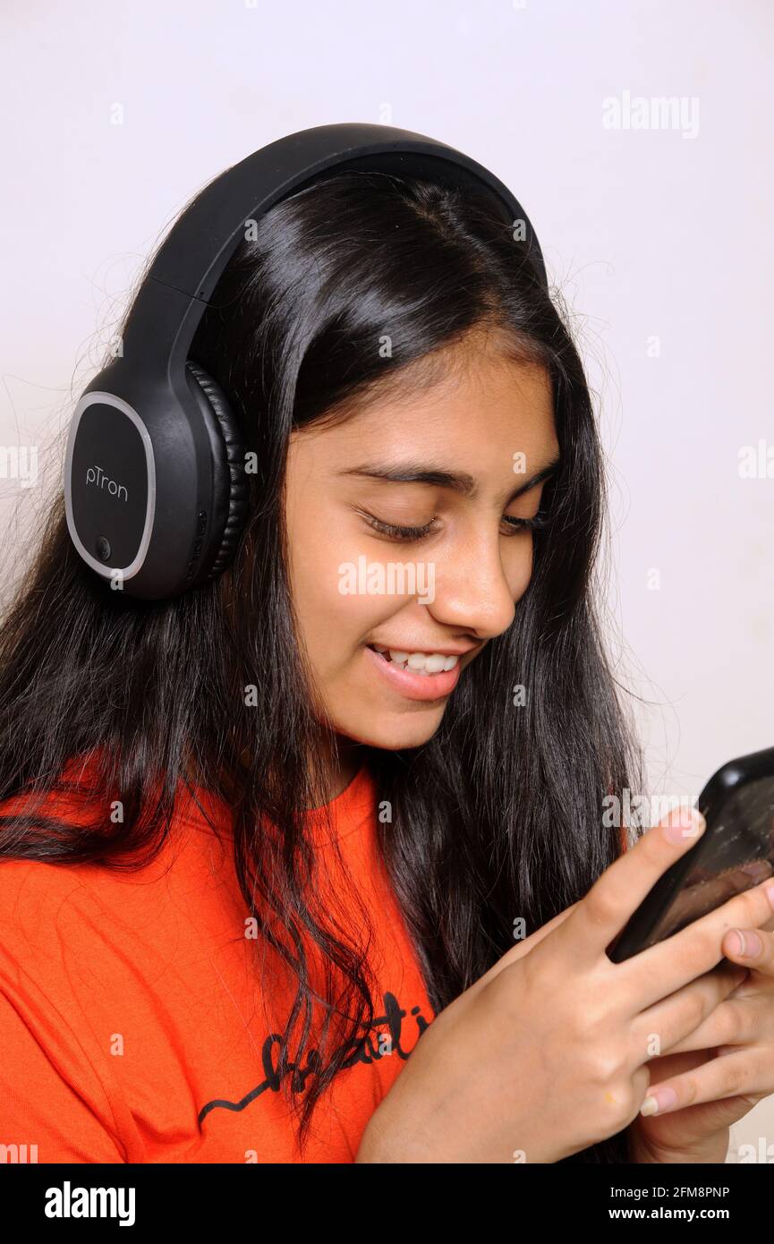 Girl in the headphones lovely indian girl teenager 14 years old ...