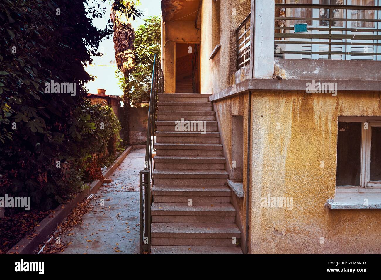 Stairs at entrance of an old house ,beautiful perspective  seen inside stairs with a garden view. Stock Photo