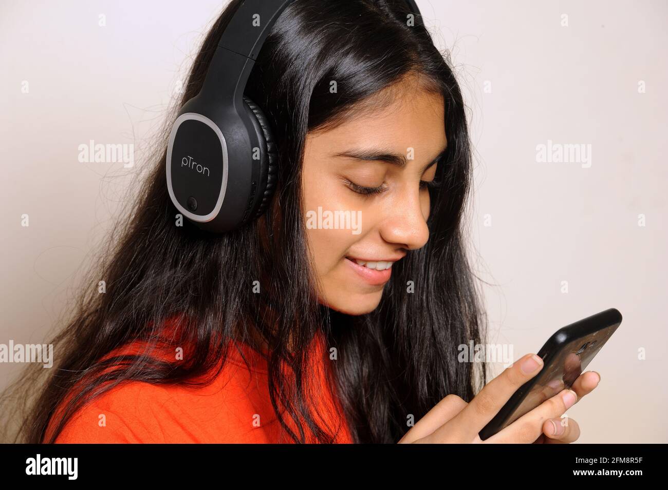 Girl in the headphones lovely indian girl teenager 14 years old ...