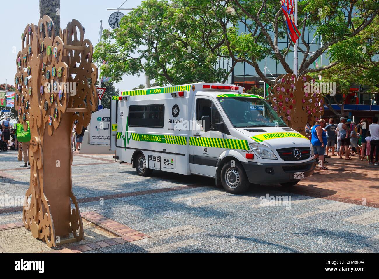 An ambulance owned by St John New Zealand standing by in downtown Tauranga, NZ, during a Christmas parade Stock Photo
