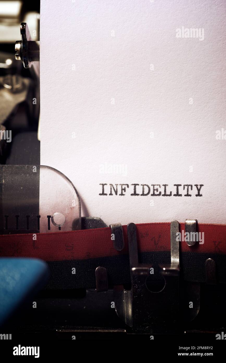 Infidelity word written with a typewriter. Stock Photo