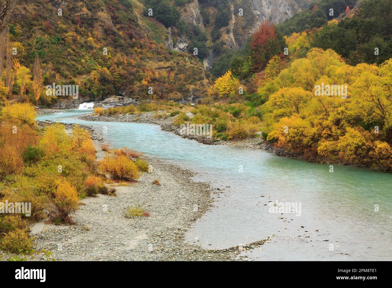 The Shotover River in the Otago region, South Island, New Zealand, on an autumn day. Photographed near Arthurs Point Stock Photo