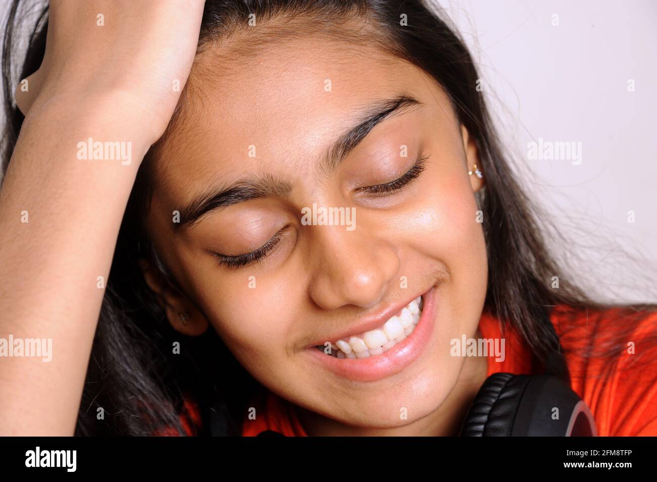 Mumbai Maharashtra India Asia April 25 2021 Portrait of lovely indian girl teenager 14 years old smiling on light background Stock Photo