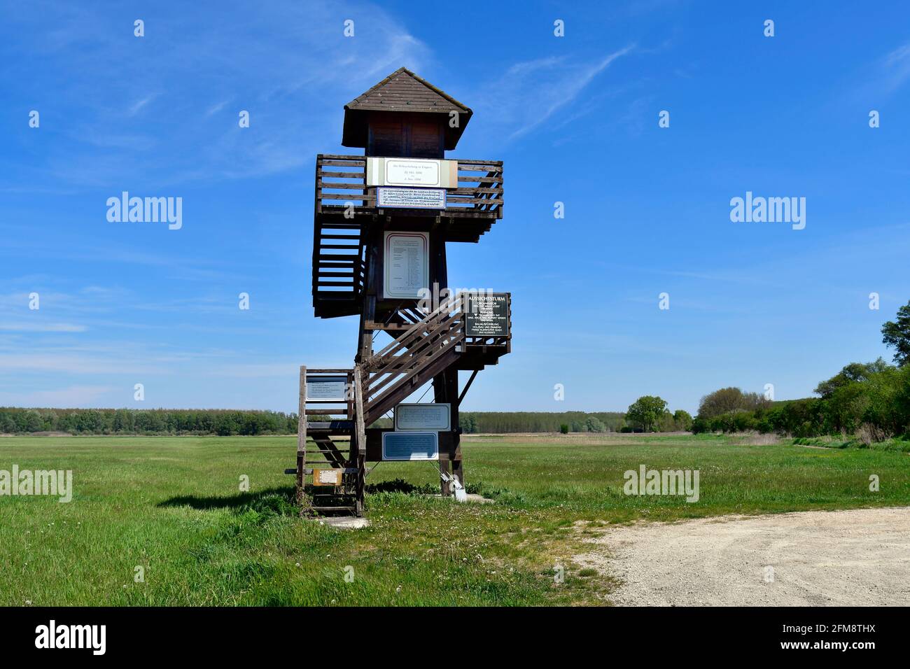 Andau, Austria - May 04, 2021: Observation tower at the rebuilt historical bridge of Andau, where the refugees from Hungary fled to Austria in 1956 fr Stock Photo