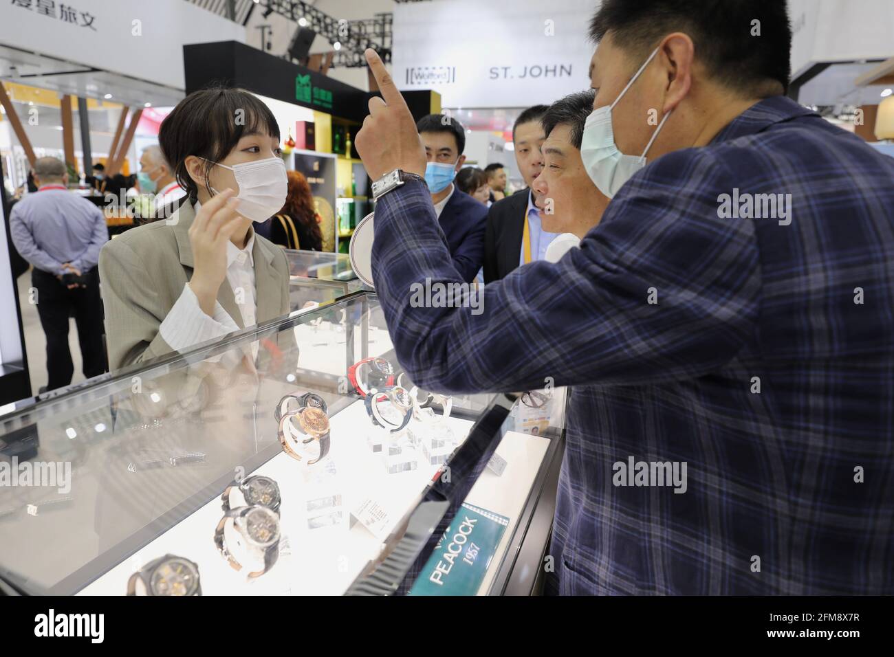 HAIKOU, May 7, 2021  Visitors ask information about watches of domestic brands in the Fashion Life Exhibition Hall of the first China International Consumer Products Expo in Haikou, capital of south China's Hainan Province, May 7, 2021. Slated for May 7-10, the first China International Consumer Products Expo has attracted 648 overseas companies and 1,365 brands from 69 countries and regions, as well as 857 enterprises and 1,263 brands from China. Covering 80,000 square meters, the expo will be the largest consumer goods expo in the Asia-Pacific region, the organizers Credit: Xinhua/Alamy Liv Stock Photo