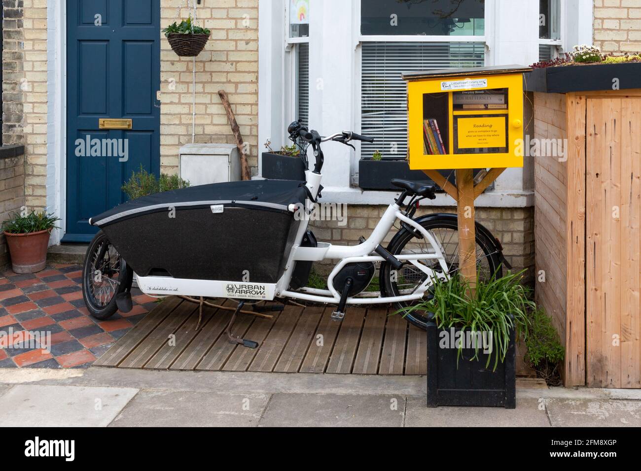 Little Free Library next to an Urban Arrow electric child carrying
