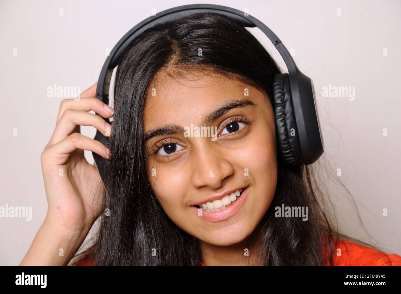 Girl in the headphones lovely indian girl teenager 14 years old ...