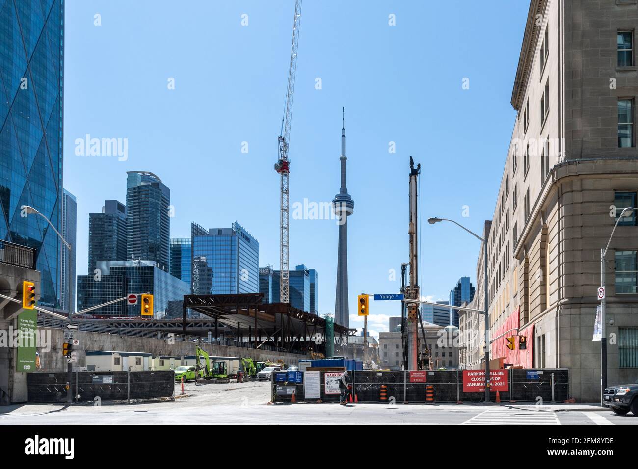 Construction site by the Saint Lawrence Hall (right). Urban sprawl due to high demand for real estate. The city skyline with the CN Tower is seen in the Stock Photo