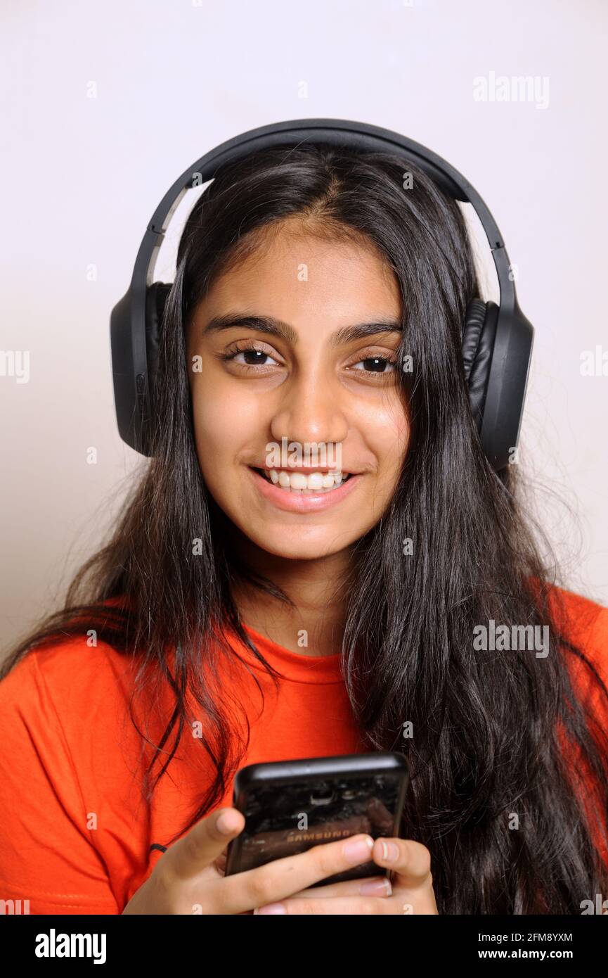 Girl in the headphones lovely indian girl teenager 14 years old ...