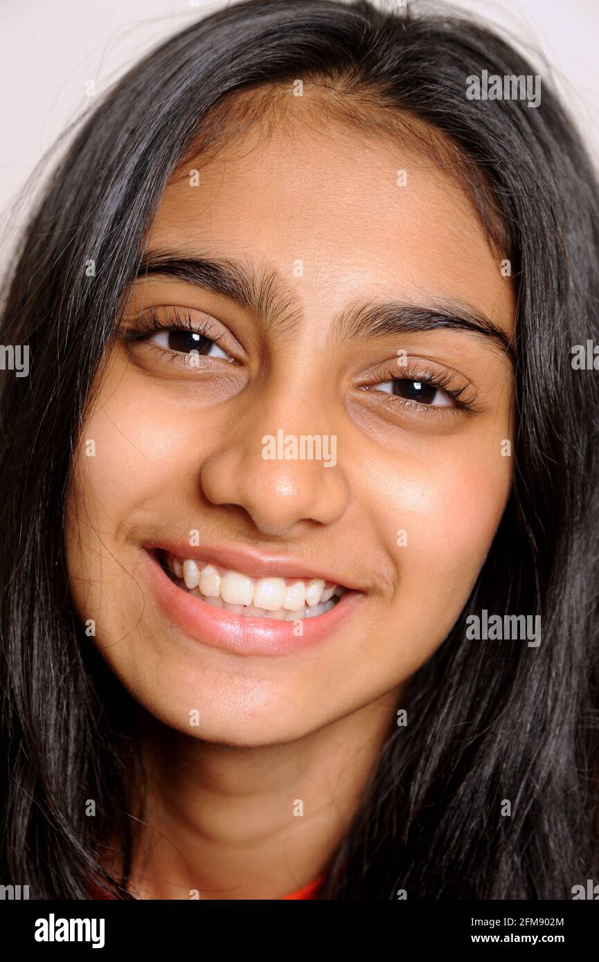 Mumbai Maharashtra India Asia April 25 2021 Portrait of lovely indian girl teenager 14 years old smiling on light background Stock Photo