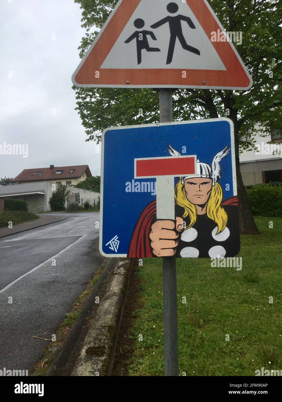 WESTON-SUPER-MARE, UK: A Viking character holding a traffic sign as if it is a weapon. THIS BRITISH graffiti artist has created a quirky series of min Stock Photo