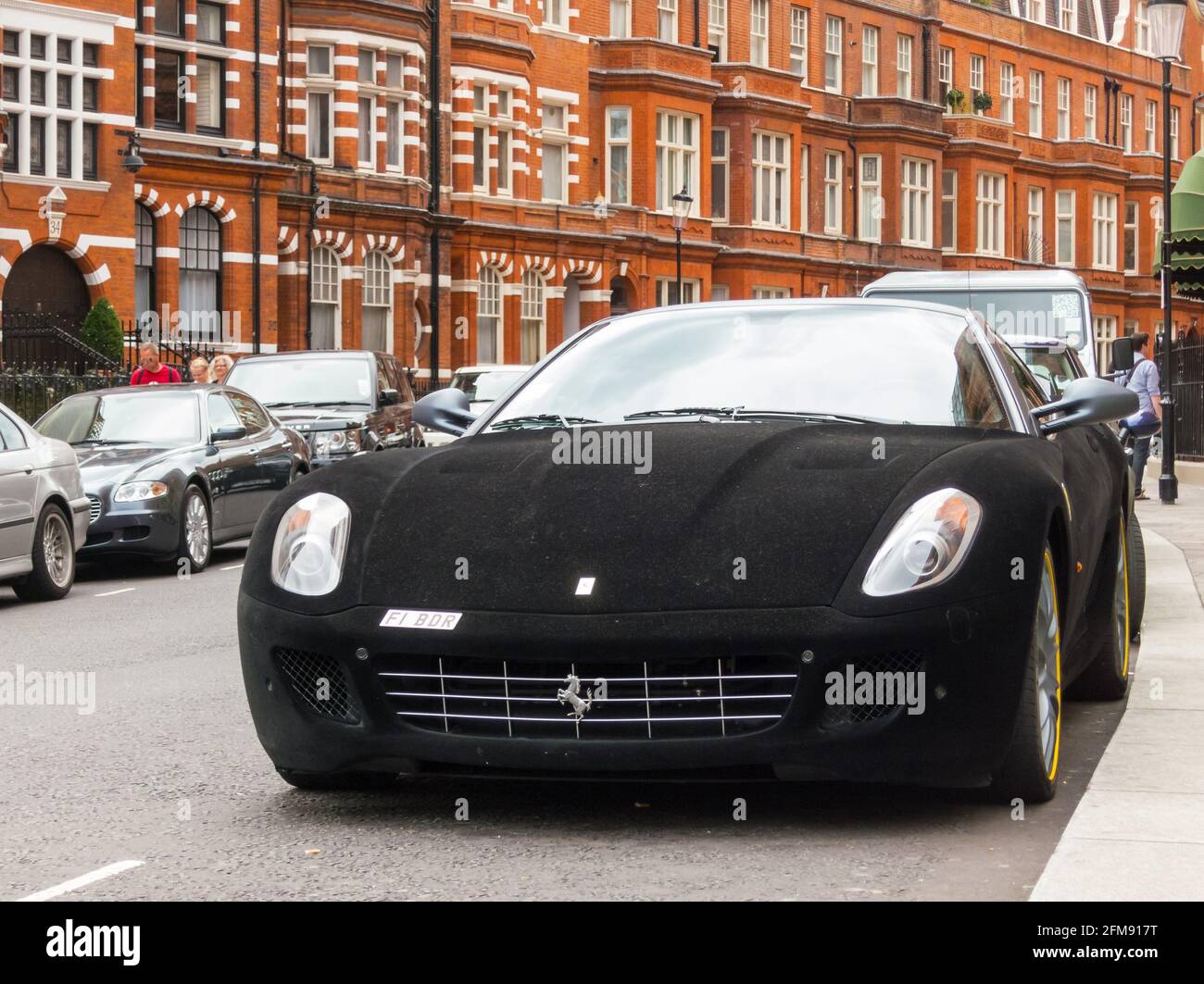 LONDON, UK - CIRCA AUGUST 2013: A Ferrari 599 GTB Fiorano with a black velvet wrap. Stock Photo