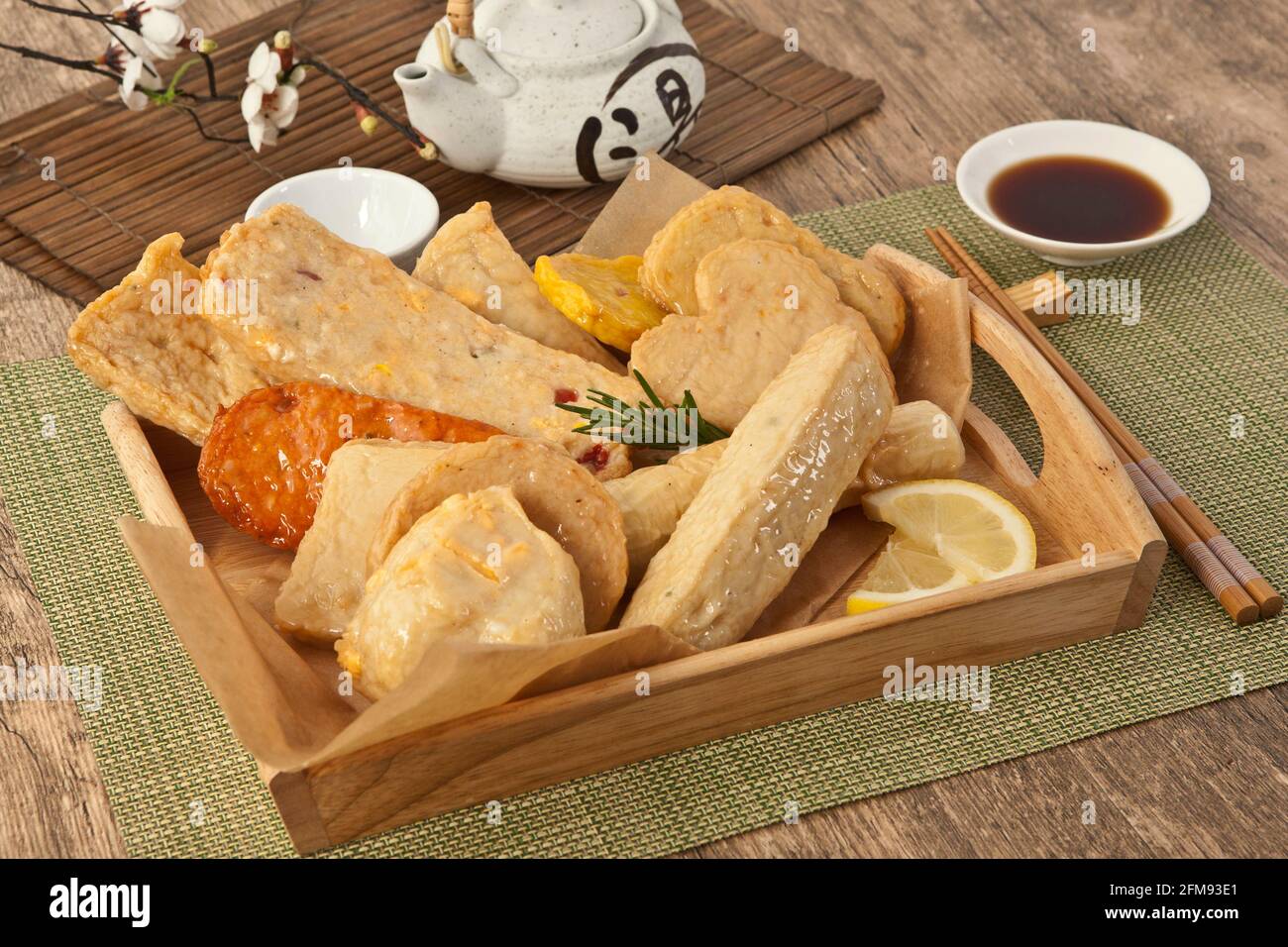 Japanese fish cake on wooden cutting board Stock Photo