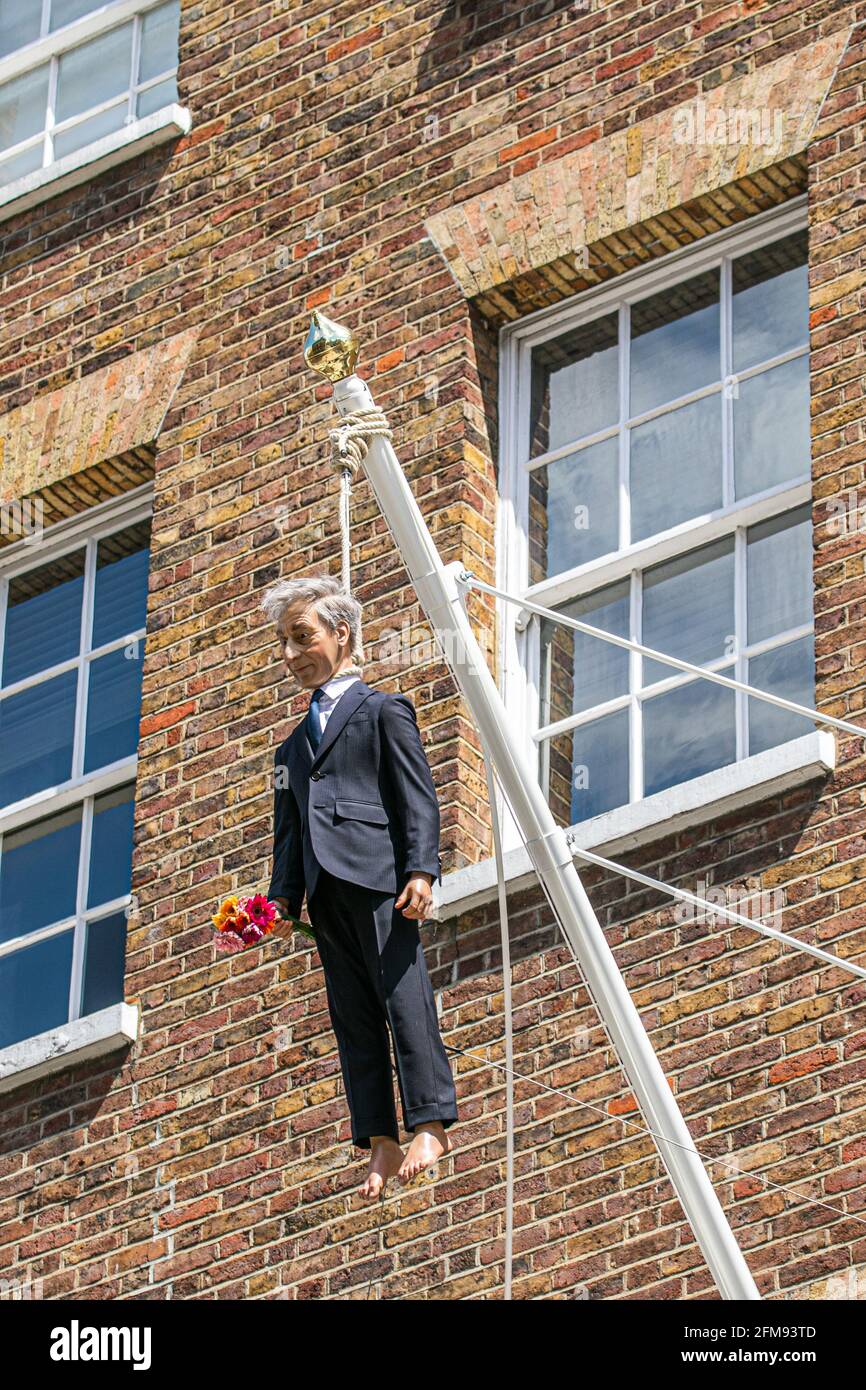 SAVILE ROW LONDON 7 May 2021. A sculpture by Italian artist Maurizio