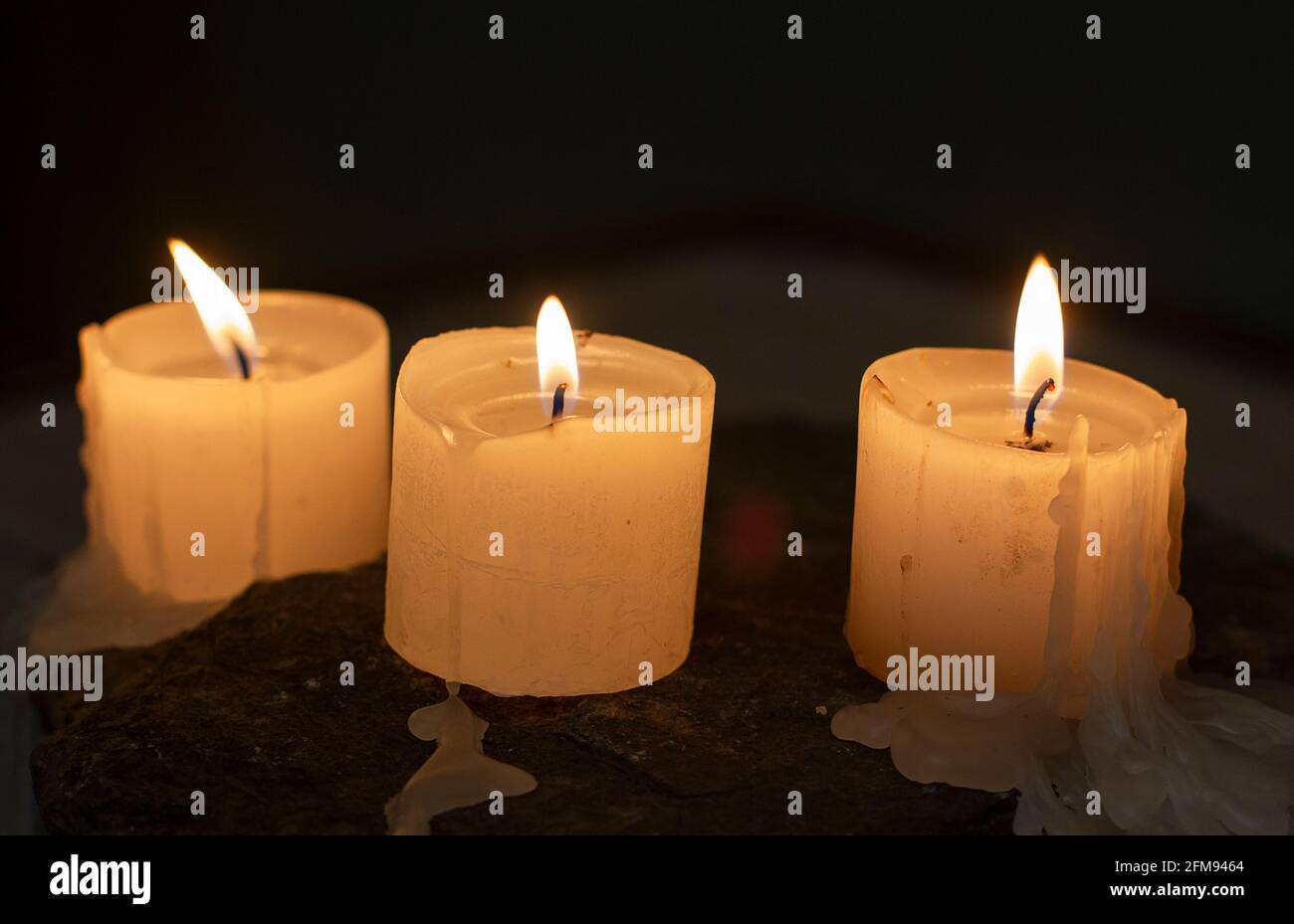 candles burning in the dark Stock Photo Alamy