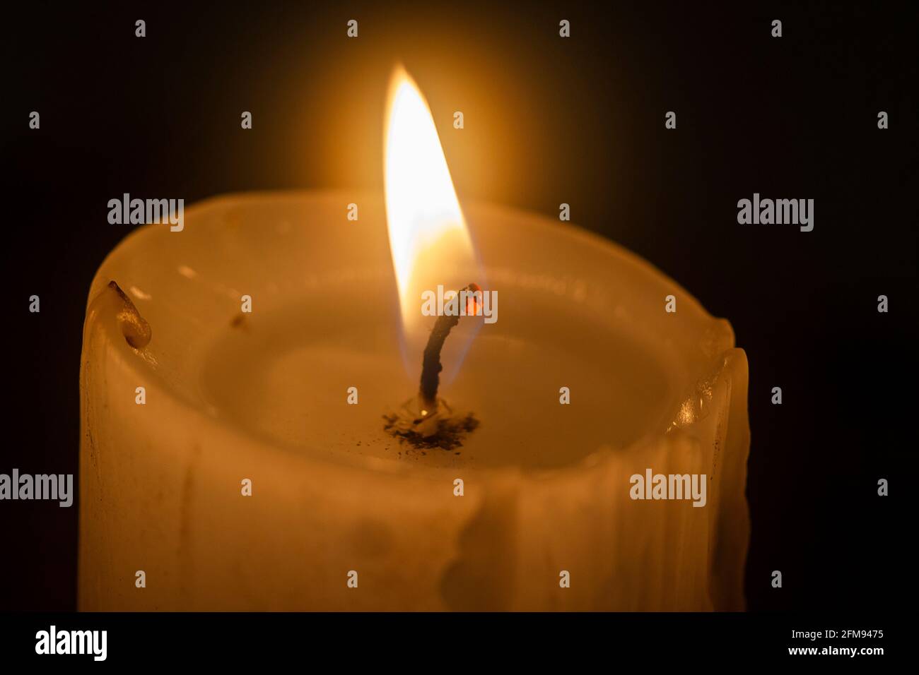 candle burning in the dark Stock Photo Alamy