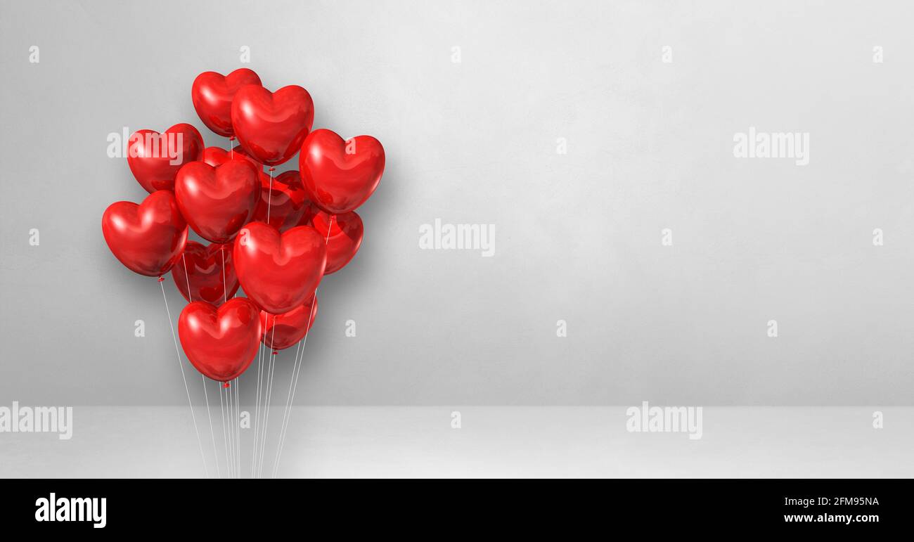Red heart shape balloons bunch on a white wall background. Horizontal ...
