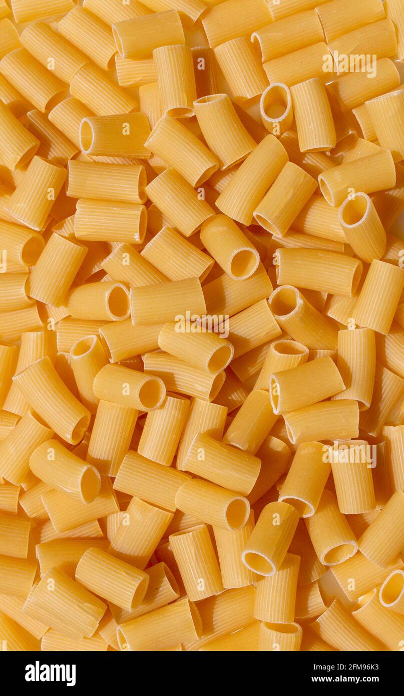 rigatoni pasta noodles food background photo with large closeup