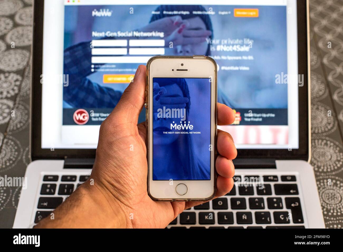 In this photo illustration a MeWe app seen displayed on a smartphone with  the MeWe logo in the background. (Photo by Thiago Prudencio / SOPA  Images/Sipa USA Stock Photo - Alamy