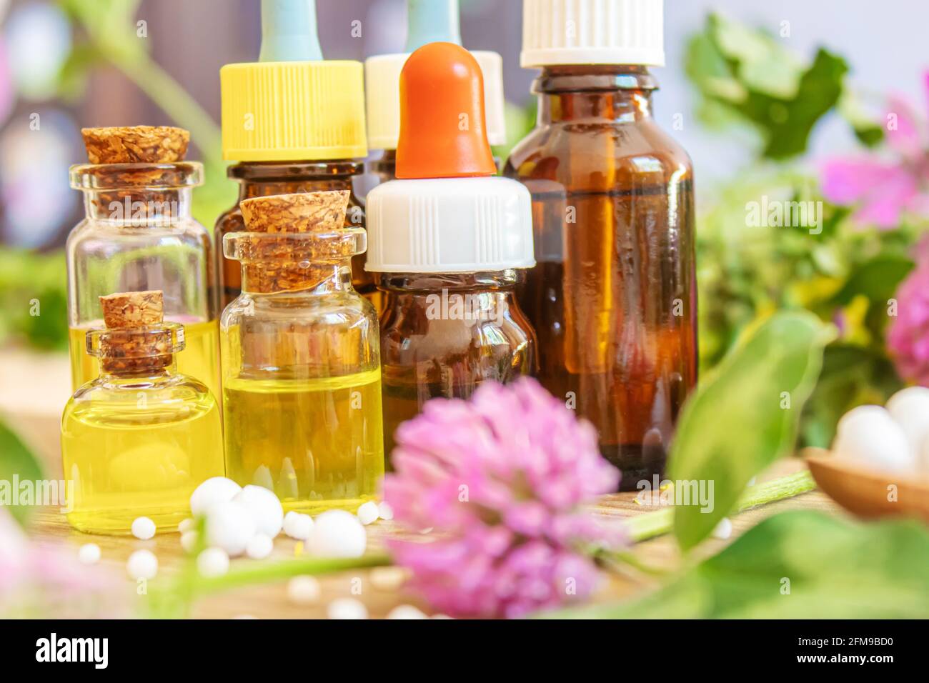medicinal herbs, oils in small bottles homeopathy. selective focus