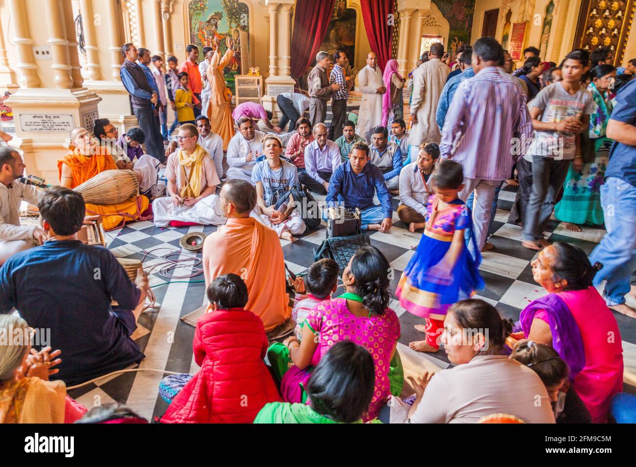 VRINDAVAN, INDIA - FEBRUARY 18, 2017: People sing Hare Krishna in Krishna Balaram Mandir temple (Temple of ISKCON organisation) in Vrindavan, Uttar Pr Stock Photo