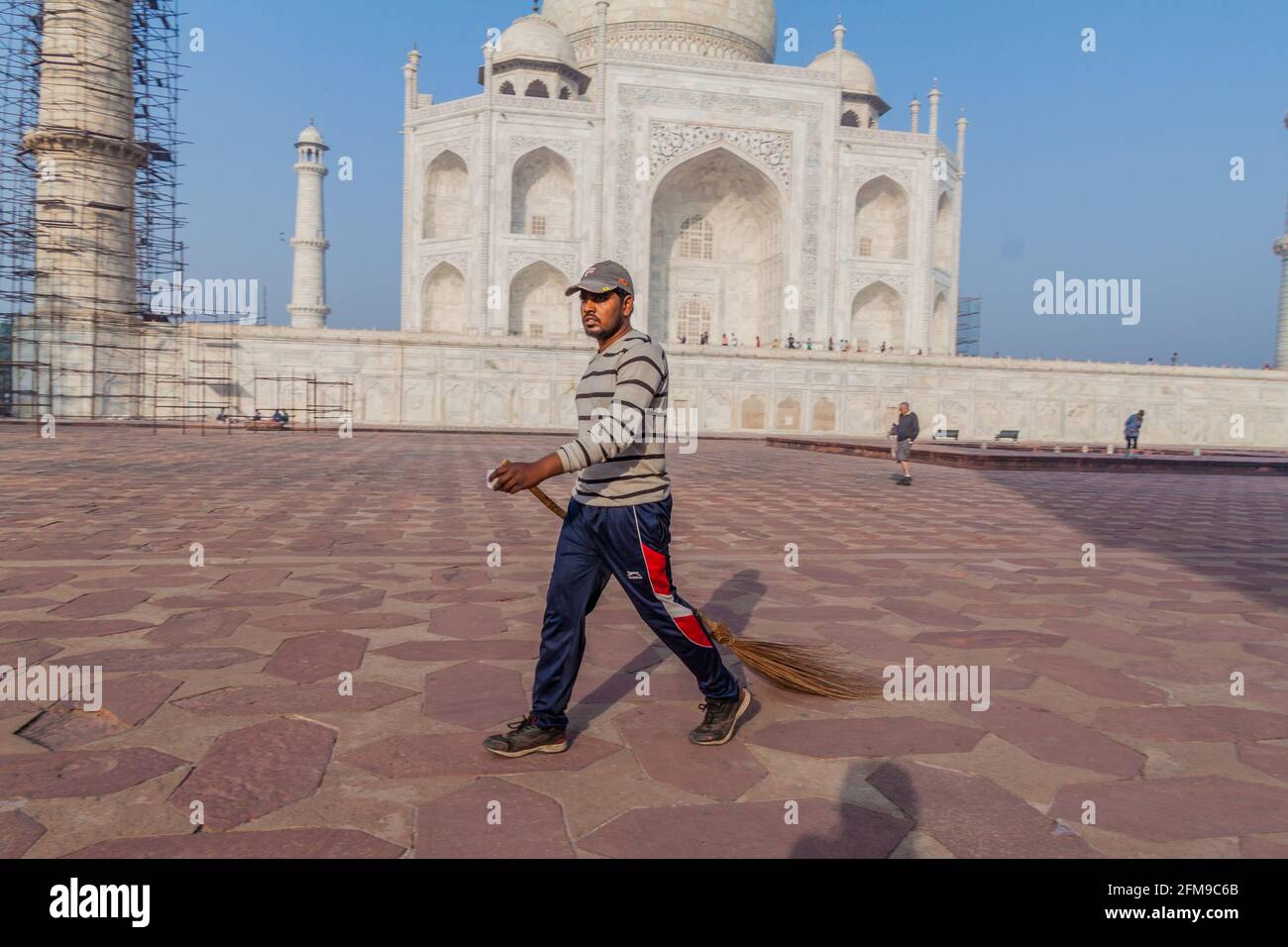 AGRA, INDIA - FEBRUARY 19, 2017: Sweeper at Taj Mahal complex in Agra, India Stock Photo