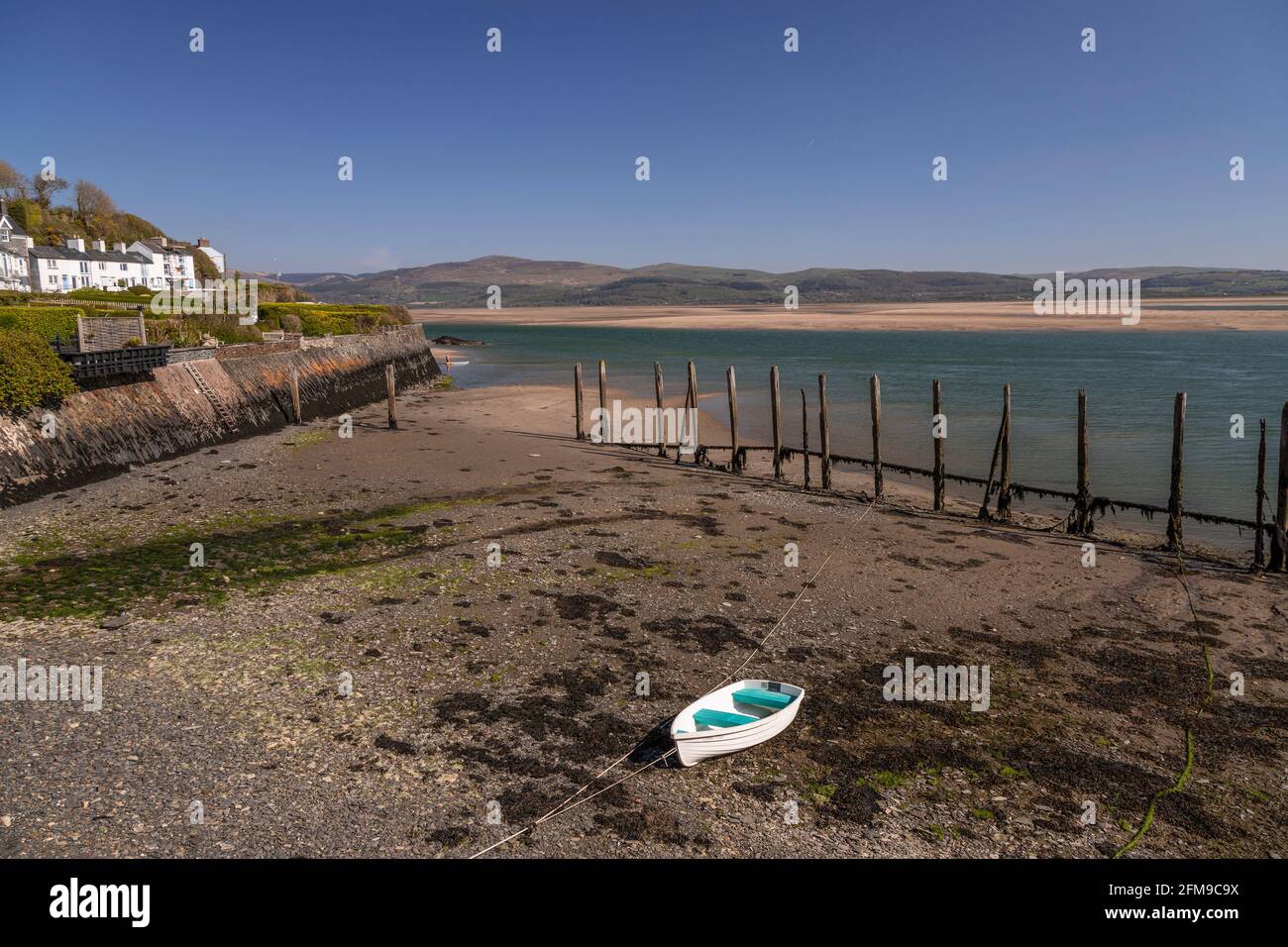 Small boat on sand at Aberdyfi on the welsh coast Stock Photo