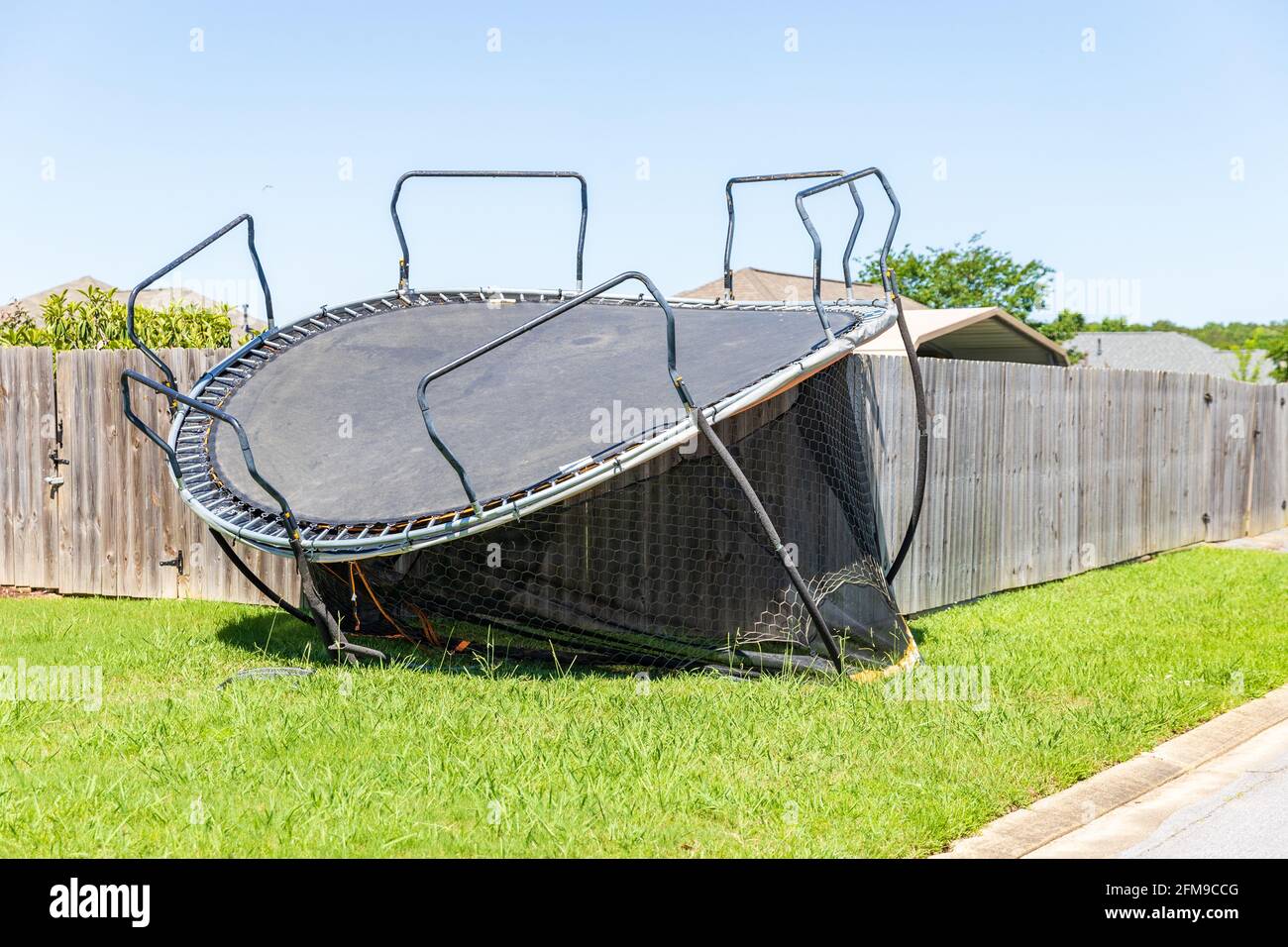 Trampoline damaged and flipped during severe storm Stock Photo - Alamy