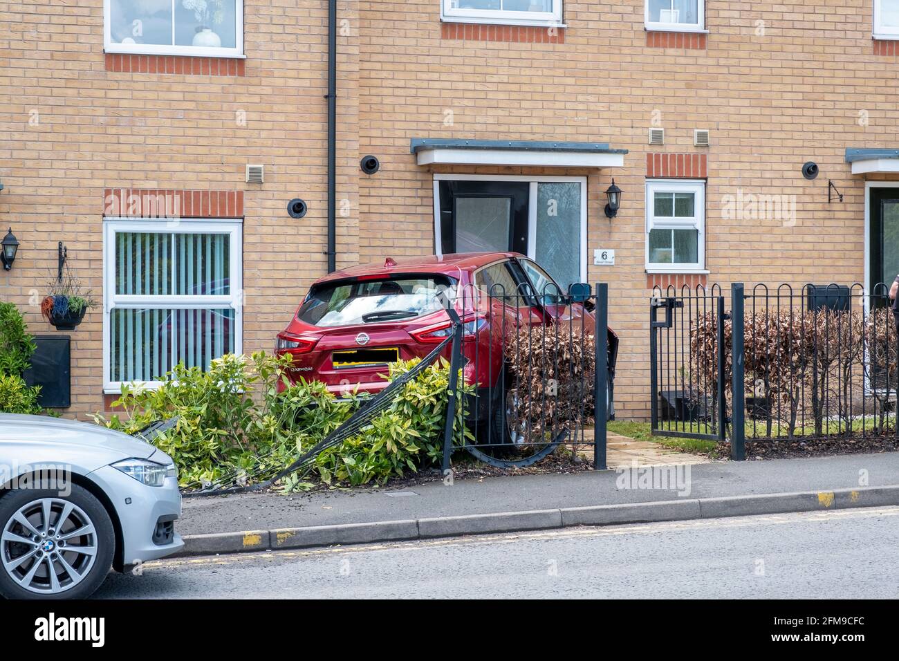Car crash in front garden of house, Brownhills, UK Stock Photo Alamy
