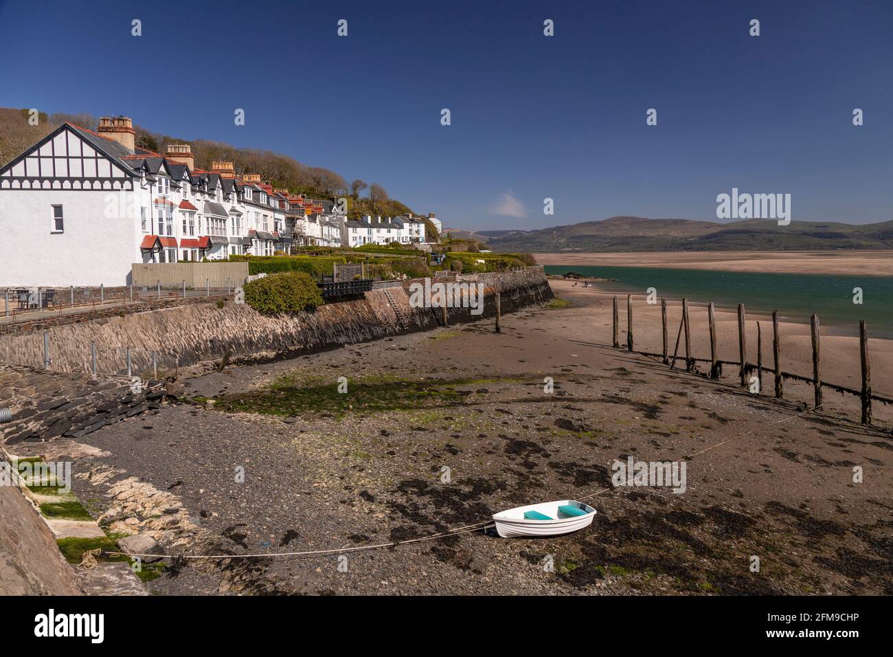 Small boat on sand at Aberdyfi on the welsh coast Stock Photo