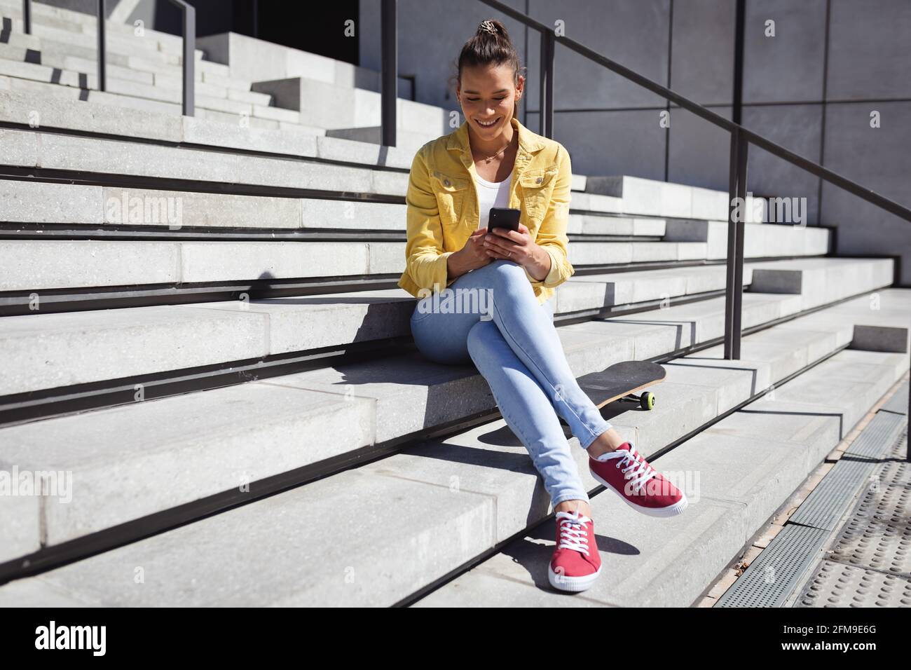 Woman sitting outdoor stairs hi-res stock photography and images - Alamy