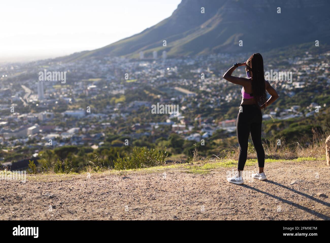 Fit african american woman admiring view during exercise in countryside Stock Photo