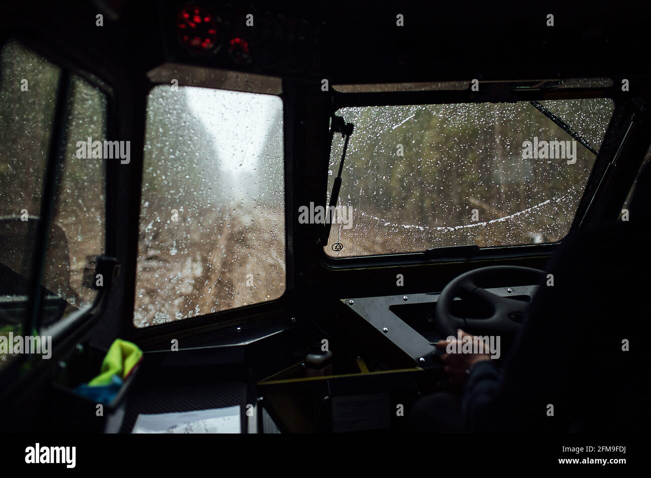 the driver is driving off-road. view from the interior of a four-wheel-drive car on a dirt road. dangerous passage of the trophy raid. extreme driving Stock Photo