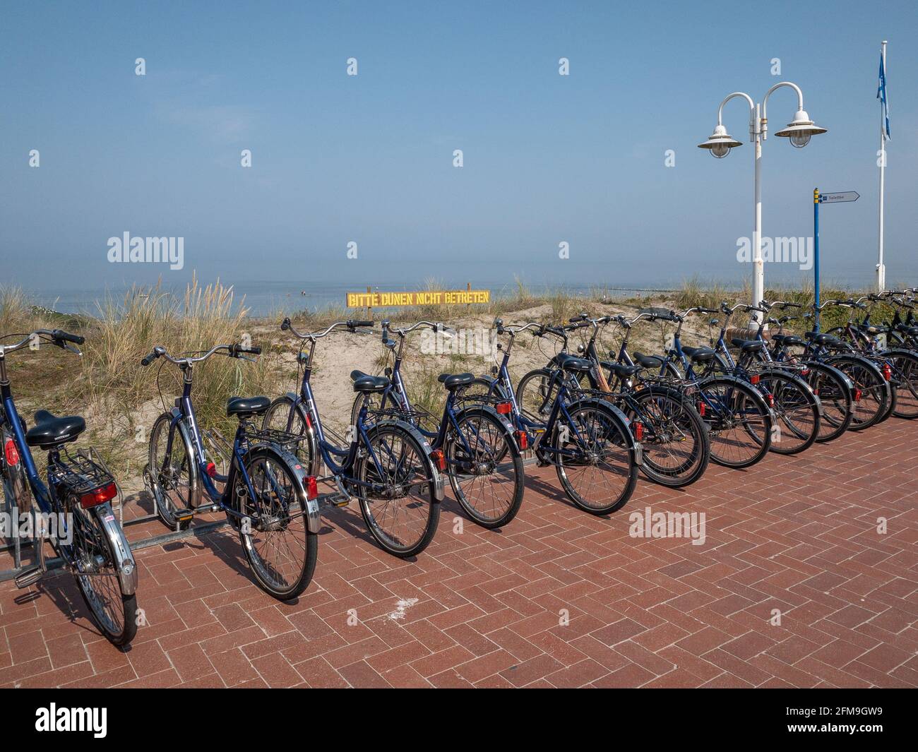 Bicycles on the Wangerooge beach promenade Stock Photo