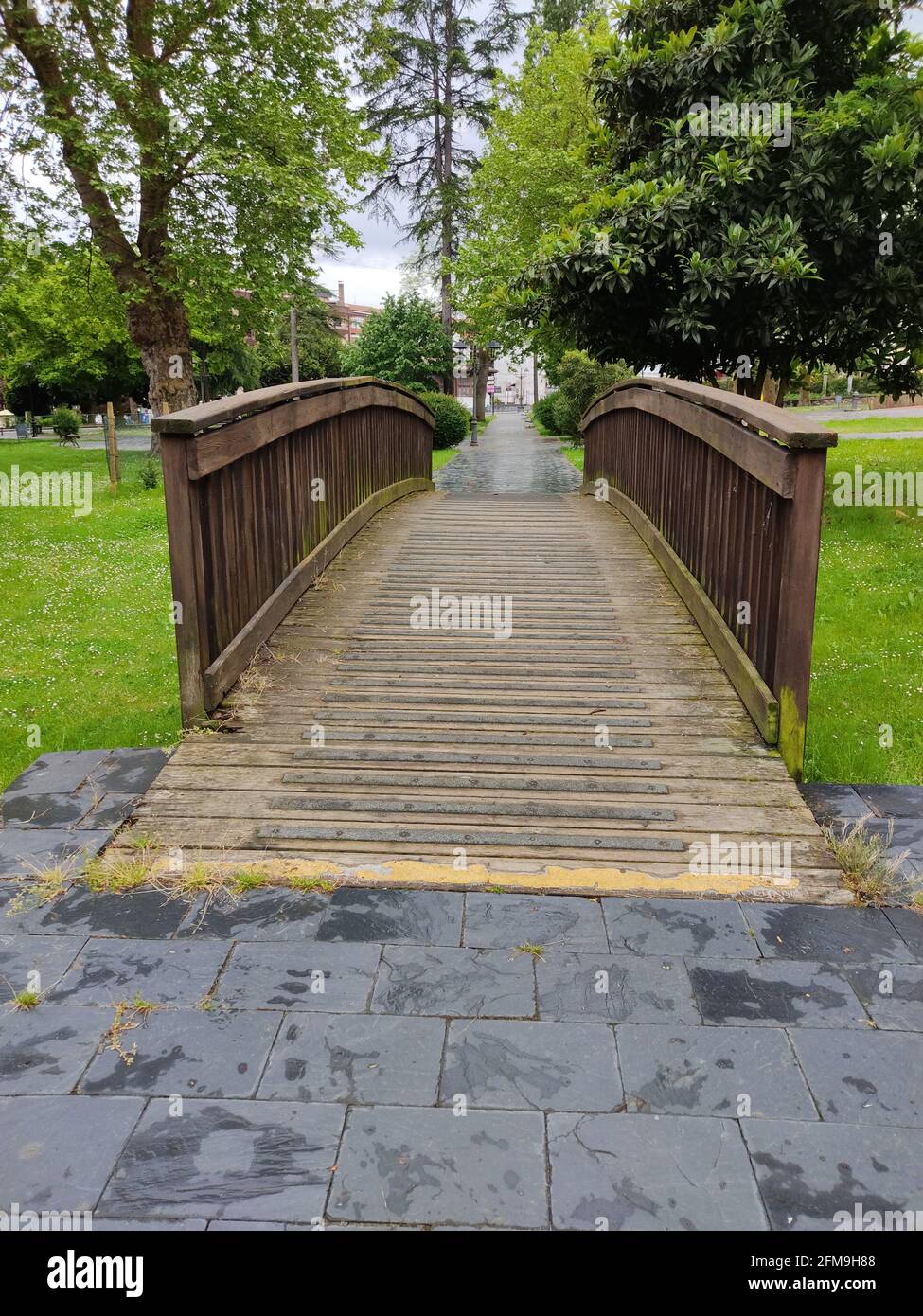 Rustic Public Bridge Sign Rustic wooden bridge in the scenic green public park Stock Photo - Alamy