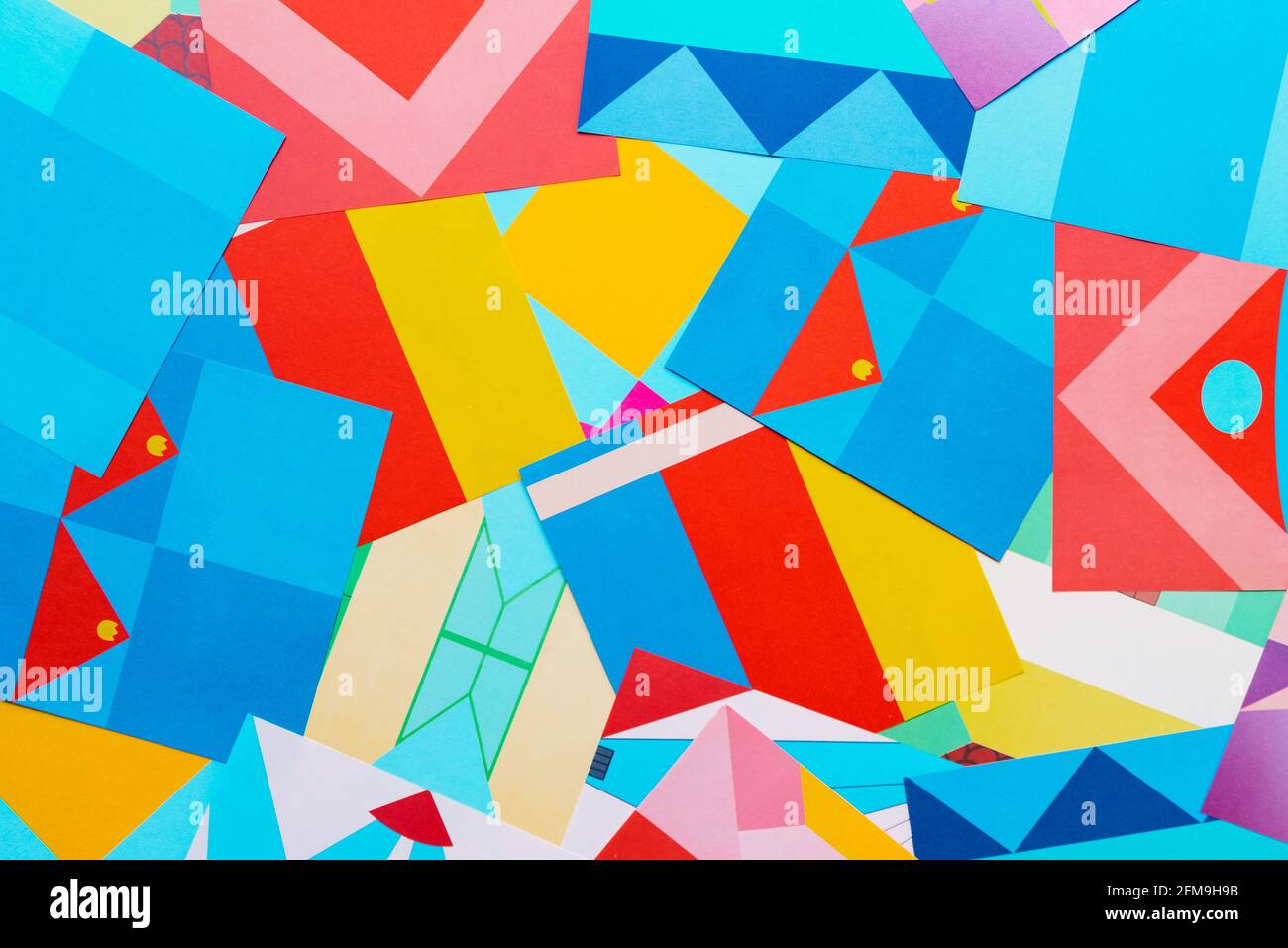 Lots of papers with geometric shapes and colors to fold and create
