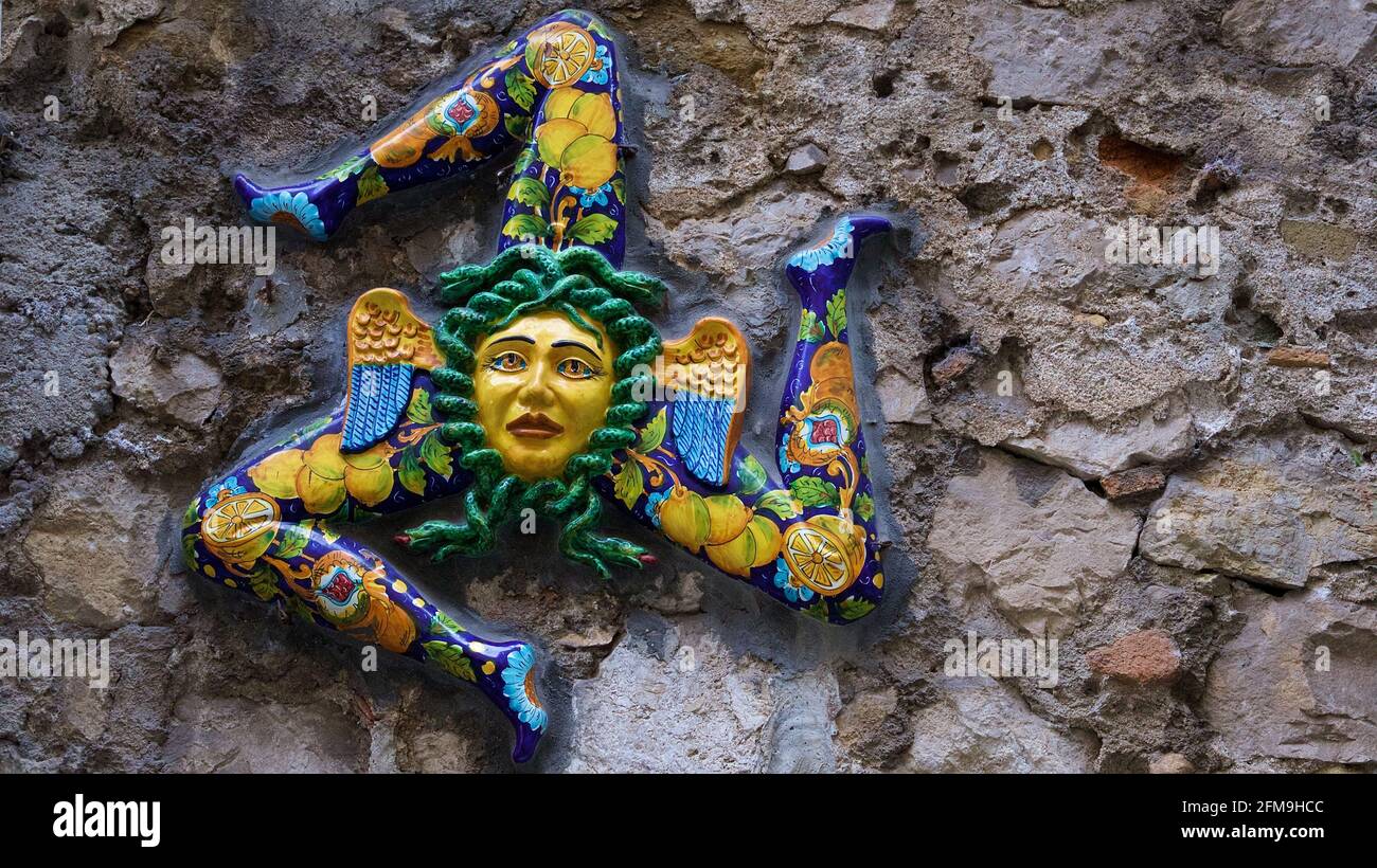 Italy, Sicily, Taormina, city center, clay colored Trinakria figure on