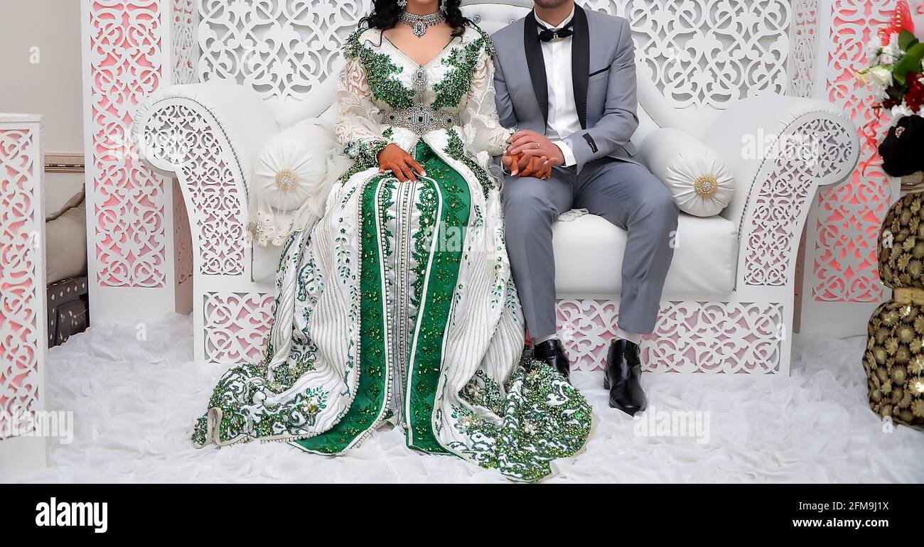 A Moroccan Arab couple dressed in traditional attire during their wedding in Tangier Stock Photo