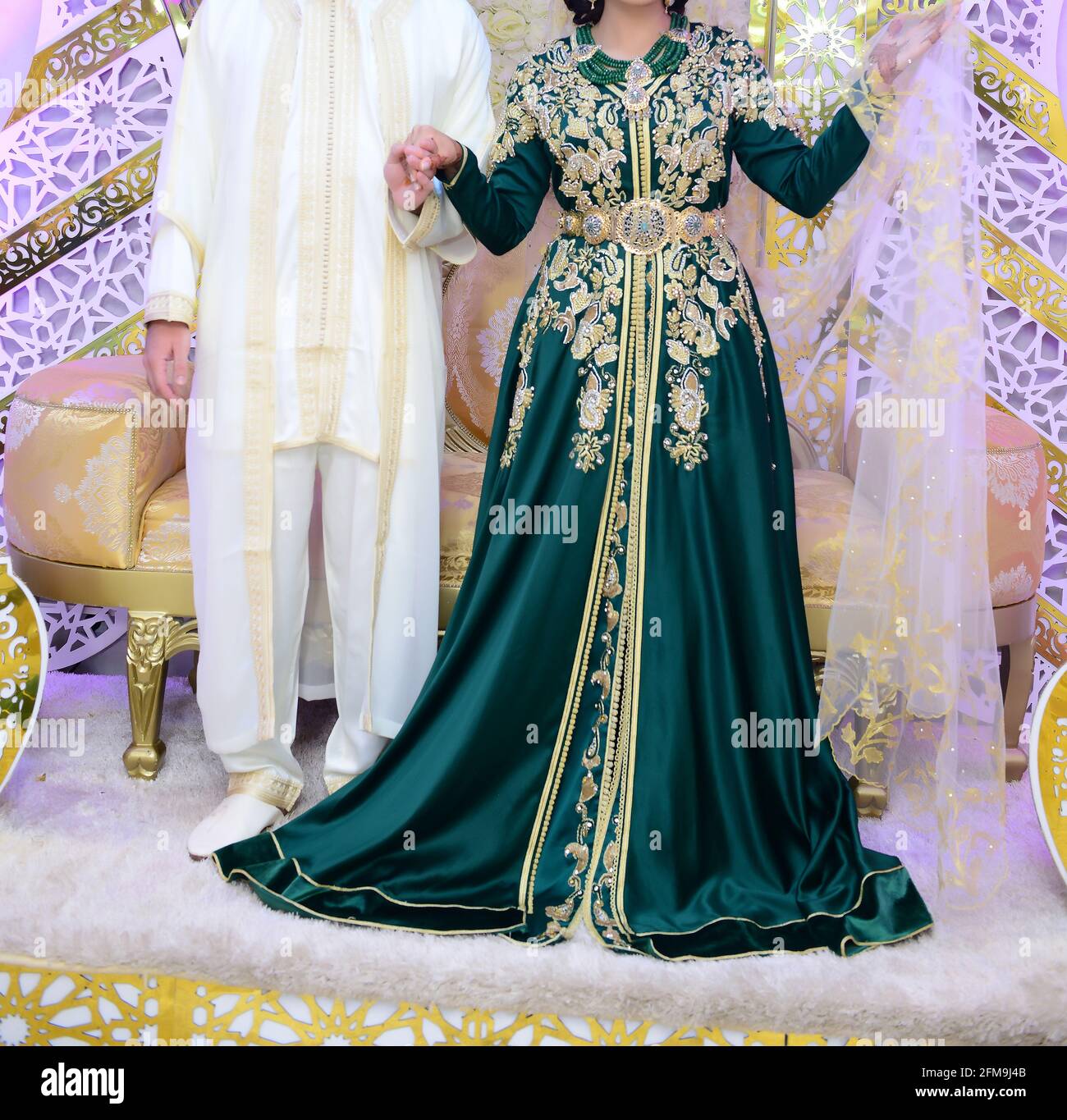 A Moroccan Arab couple dressed in traditional attire during their wedding in Tangier Stock Photo