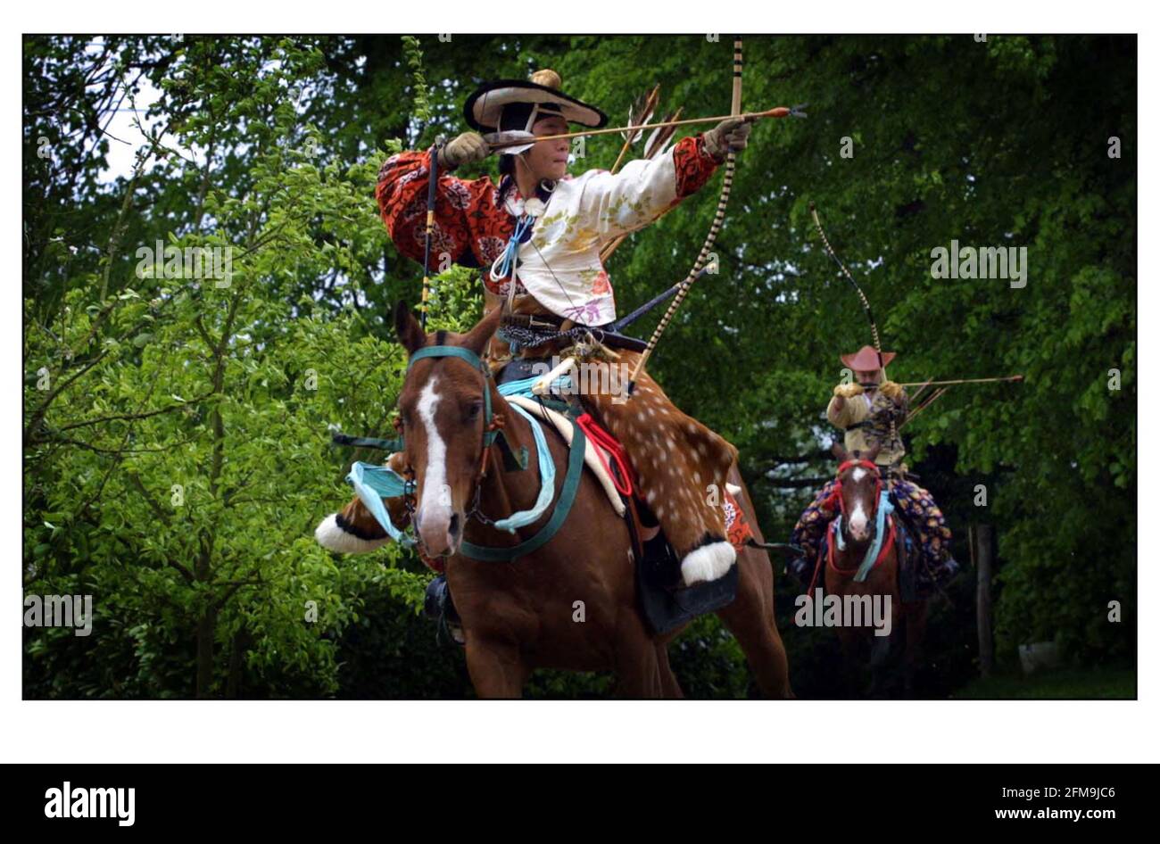 Members of the OGASAWARA school May 2001 of traditional horseback archery practice 'Yabusame' for a display at Japan 2001 Matsuri in Hyde Park this weekend. Stock Photo