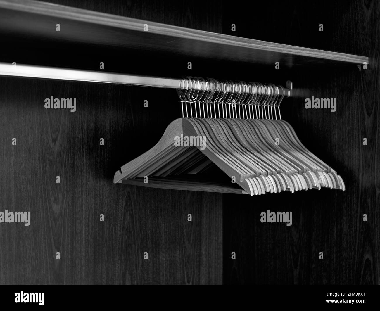 30 coat hangers in an open cloakroom Stock Photo Alamy