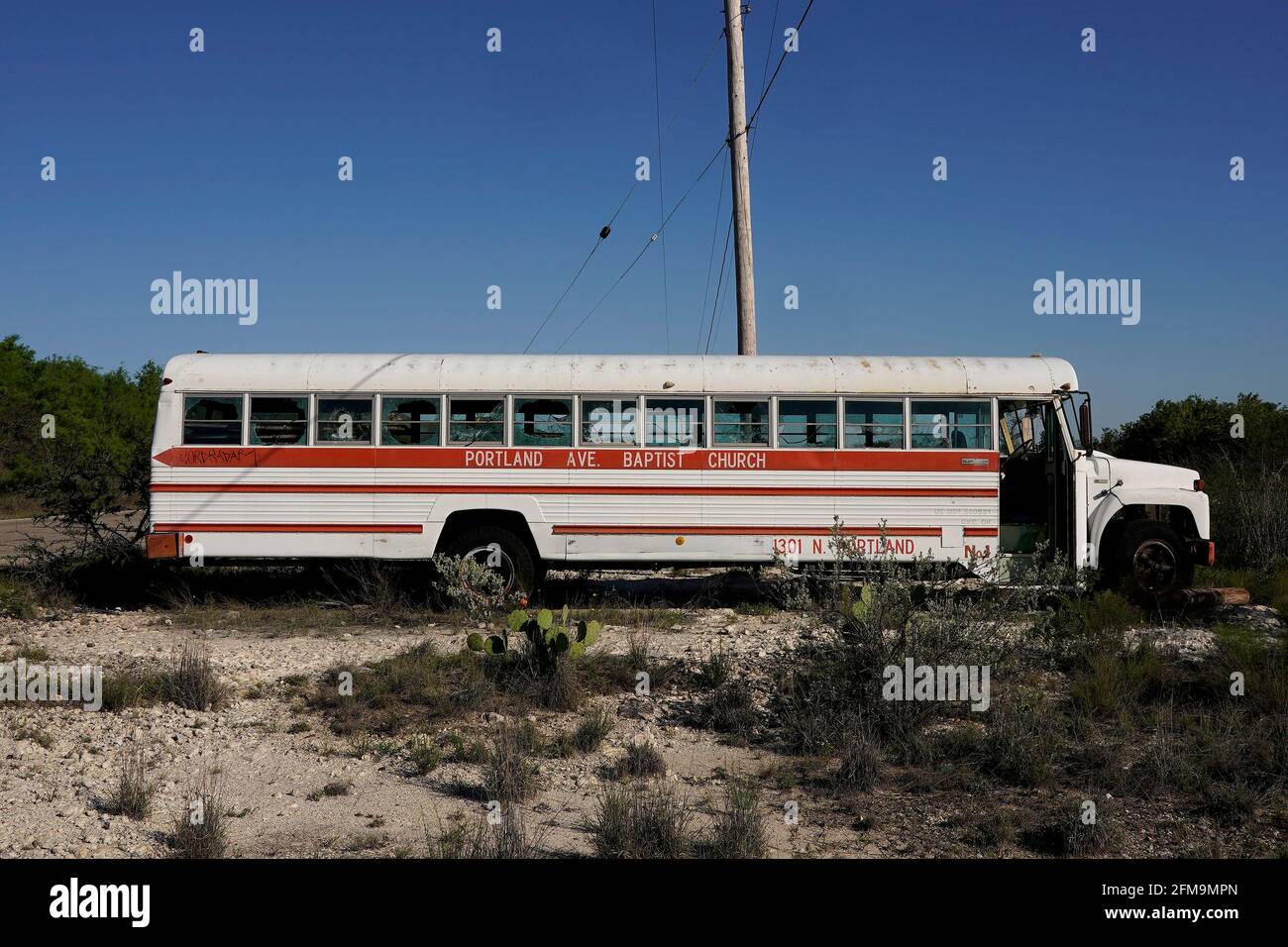 A bus filled with discarded clothes that migrants have left after ...