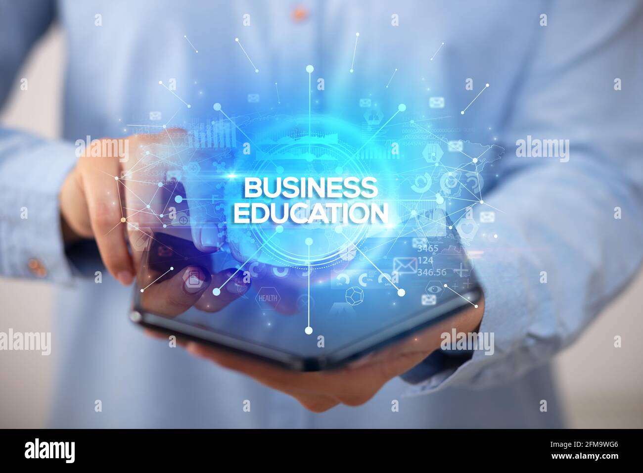 Businessman holding a foldable smartphone, new business concept Stock Photo